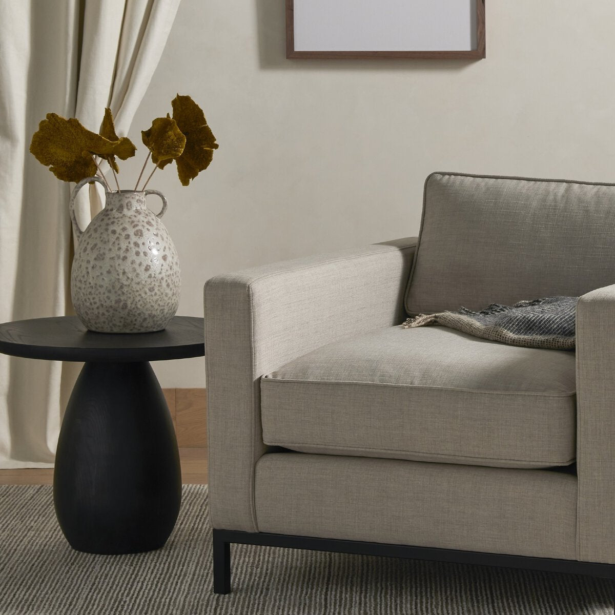 Rounded Black Ash Wood End Table - Styled View